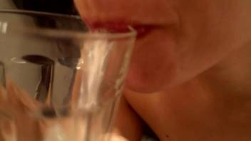 amateur girlfriend plays with a glass of cum